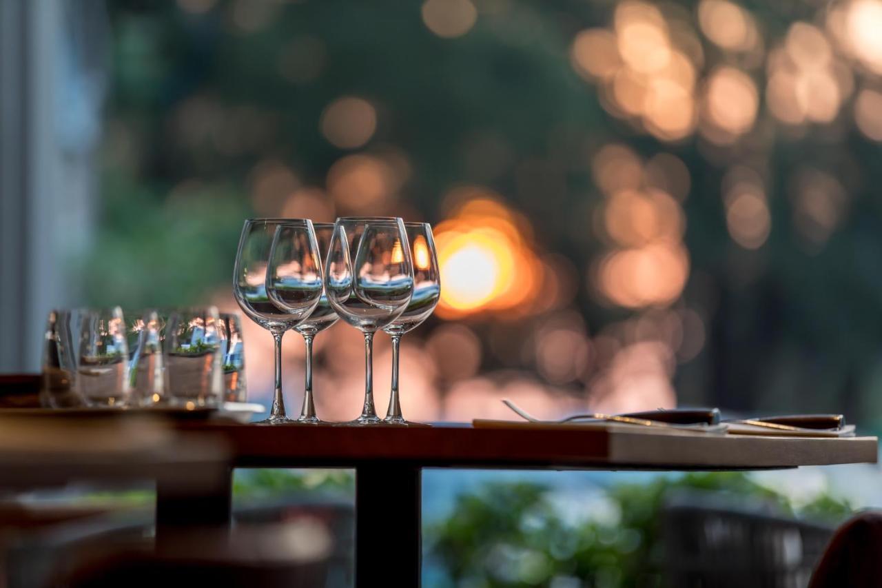 Outrigger Surin Beach Resort - Sha Extra Plus Exterior foto Wine glasses